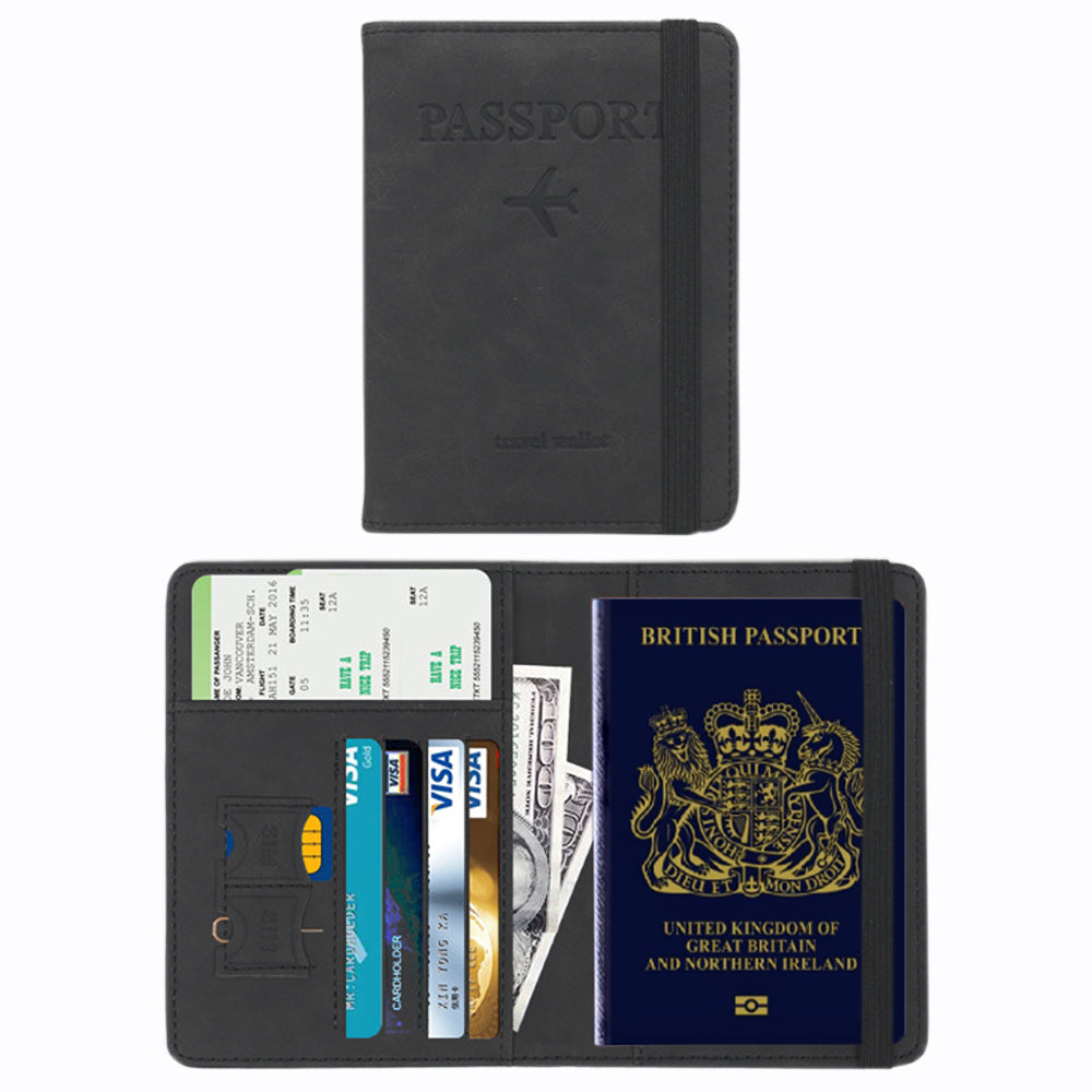 Black passport holder with British passport and travel documents on a white background