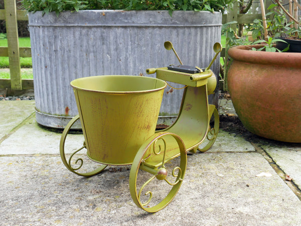Vintage Style Scooter shape metal planter with light up solar headlight, distressed green finish