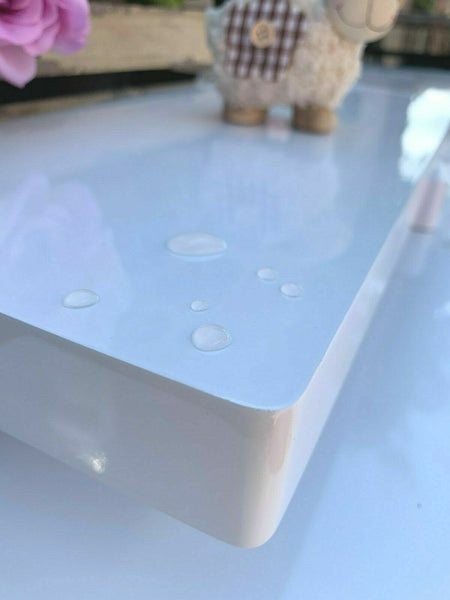 40cm long high gloss float shelf. It sticks out 20cm from the wall and has rounded corners. The shelf has a thickness of 3.8cm, colour white.